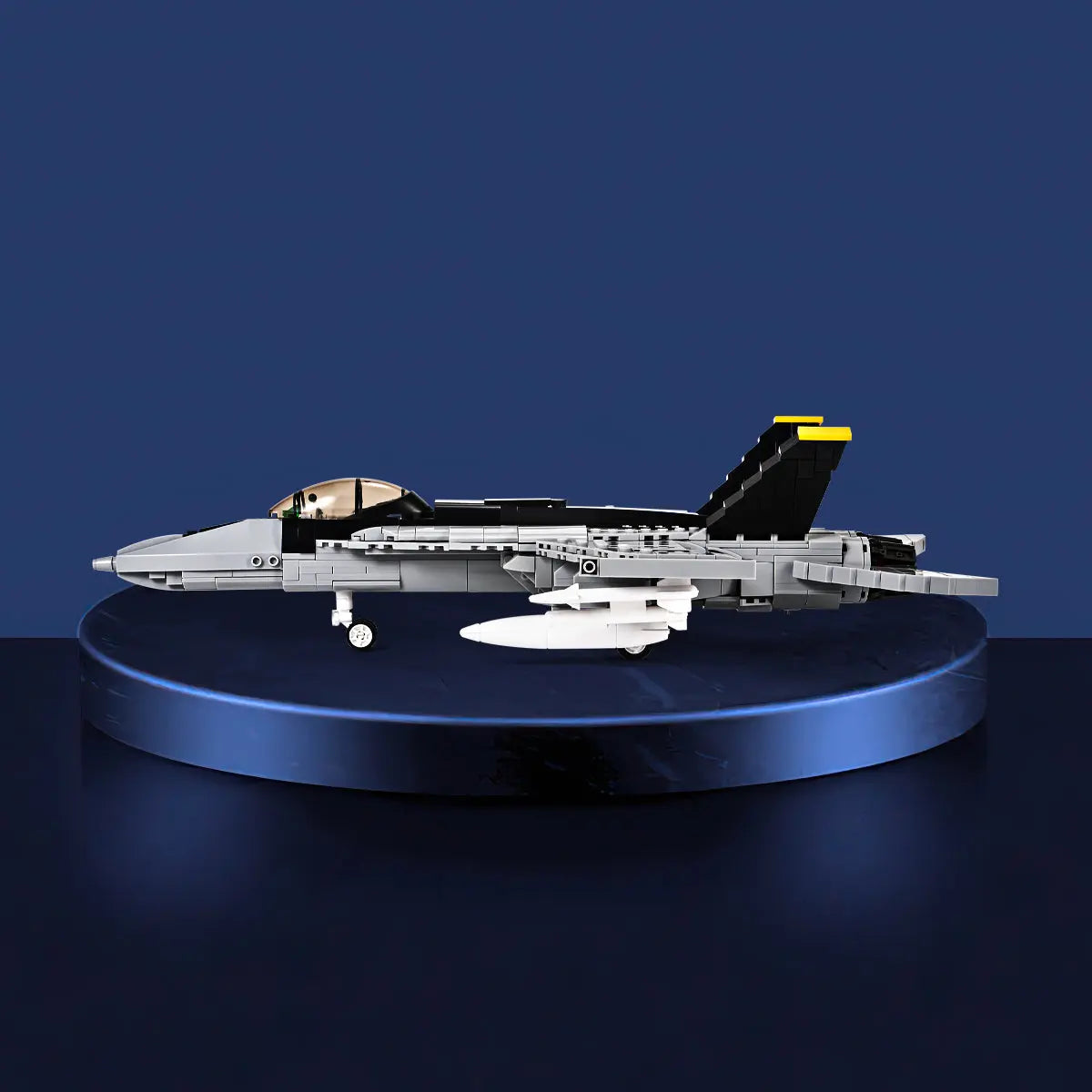 Sleek side profile display of the finished DAHONPA FA18E fighter jet Building Blocks set on a showroom pedestal