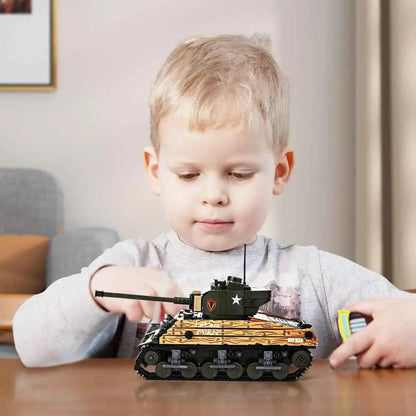 Young builder focusing on the detailed mechanical structures of the DAHONPA military tank building blocks model